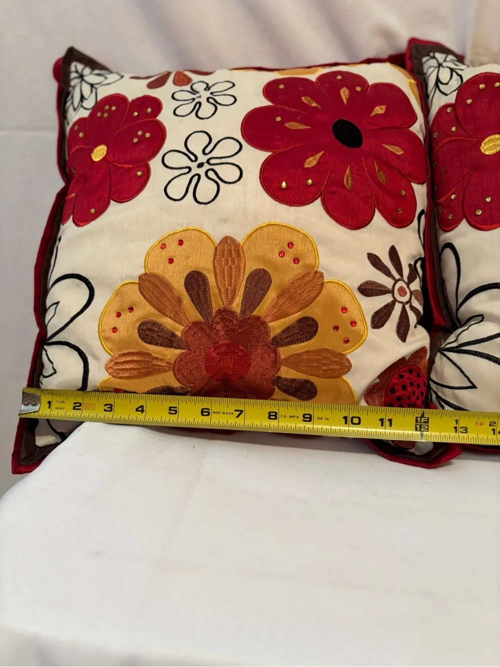 Pier 1 Imports pillows vibrant floral embroidery in red and gold